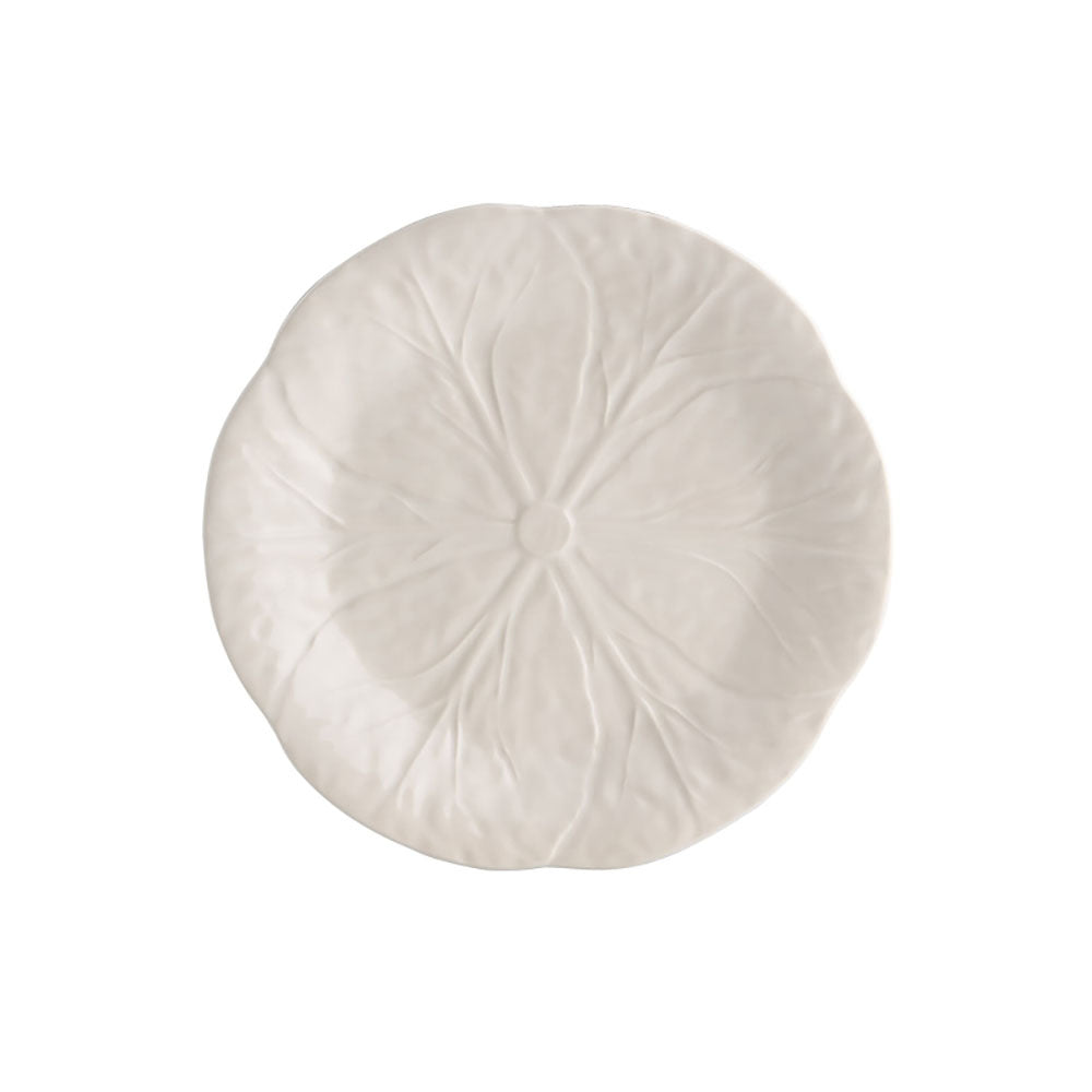 Round white pillow with pleated texture on a white background