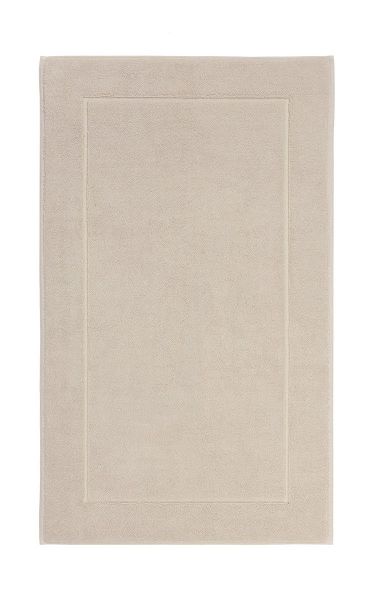 Aquanova London Bath mat-Beige bath mat with a border on a white background