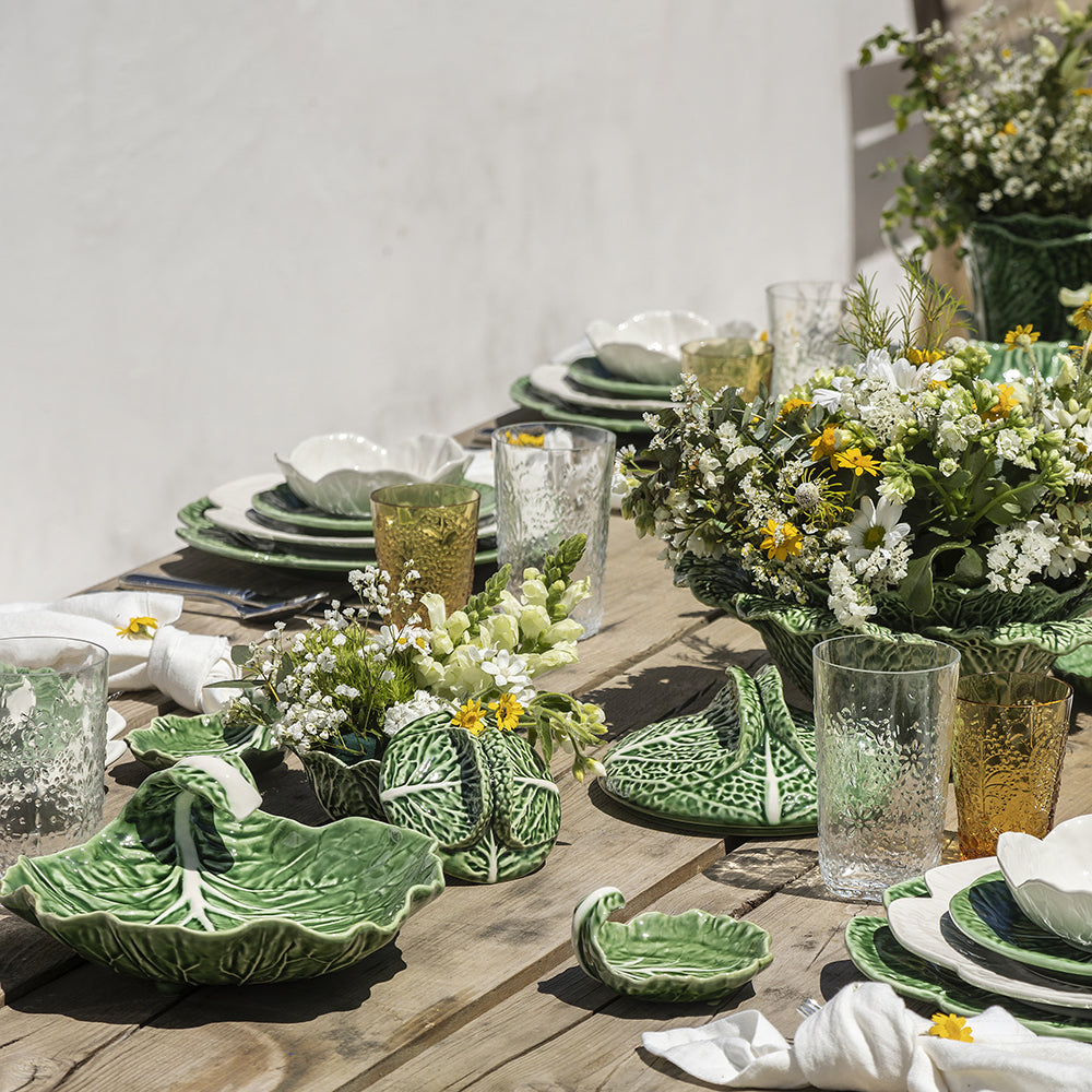 Bordallo Pinheiro Cabbage Chip & Dip Bowl-Outdoor table setting with green ceramic plates and floral decorations.