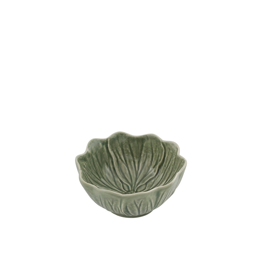 Green ceramic bowl with leaf design on a white background