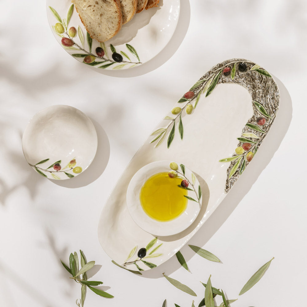 Bordallo Pinheiro Olival Platter-Decorative plate with olive design holding a bowl of olive oil on a light background