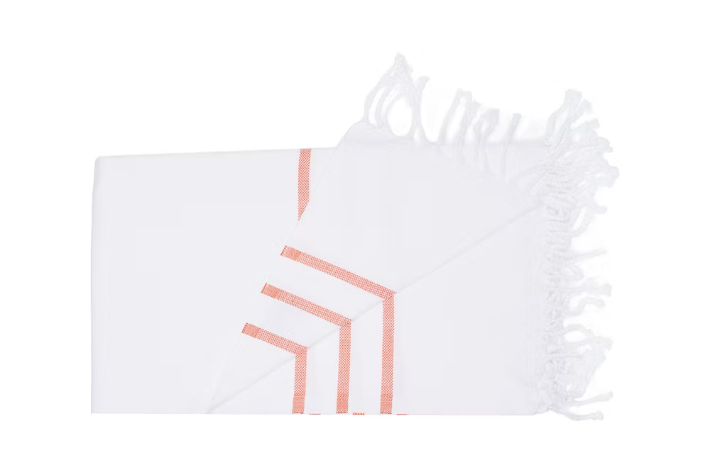 Coral Beach Towel-White pillowcase with geometric pink design on a white background