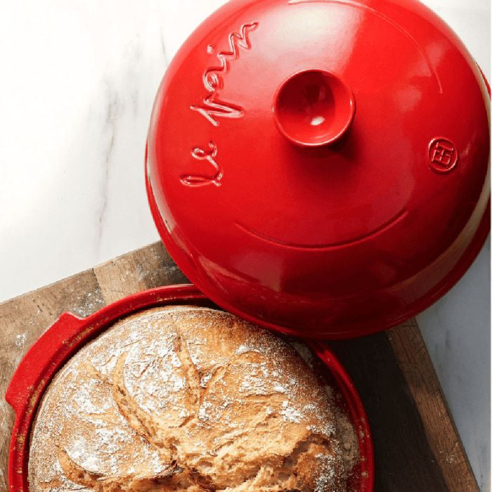 Emile Henry Bread Baker-Loaf of bread in a red ceramic dish with 'Le Vin' branding on a white background