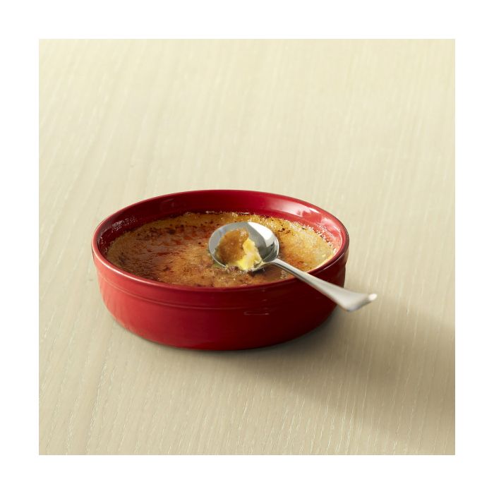 Emile Henry Crème Brûlée Dishes, Set of 2-Red bowl of creme bréle with a spoon on a beige background