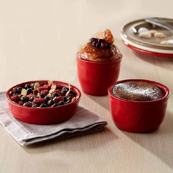 Emile Henry Ramekins, Set of 2-Three red ramekins with desserts on a beige surface