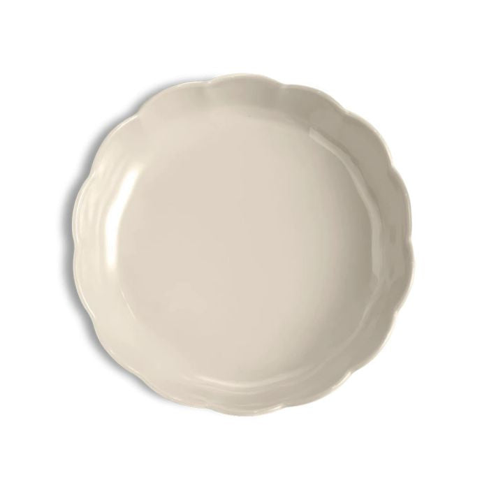 Emile Henry Round Cake Dish-Beige ceramic plate on a white background
