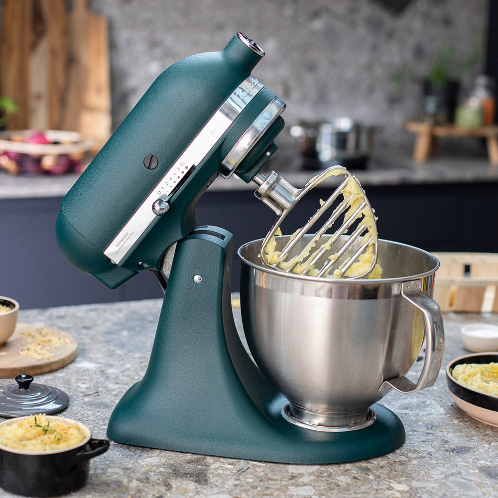 KitchenAid Green stand mixer with a silver bowl on a kitchen counter