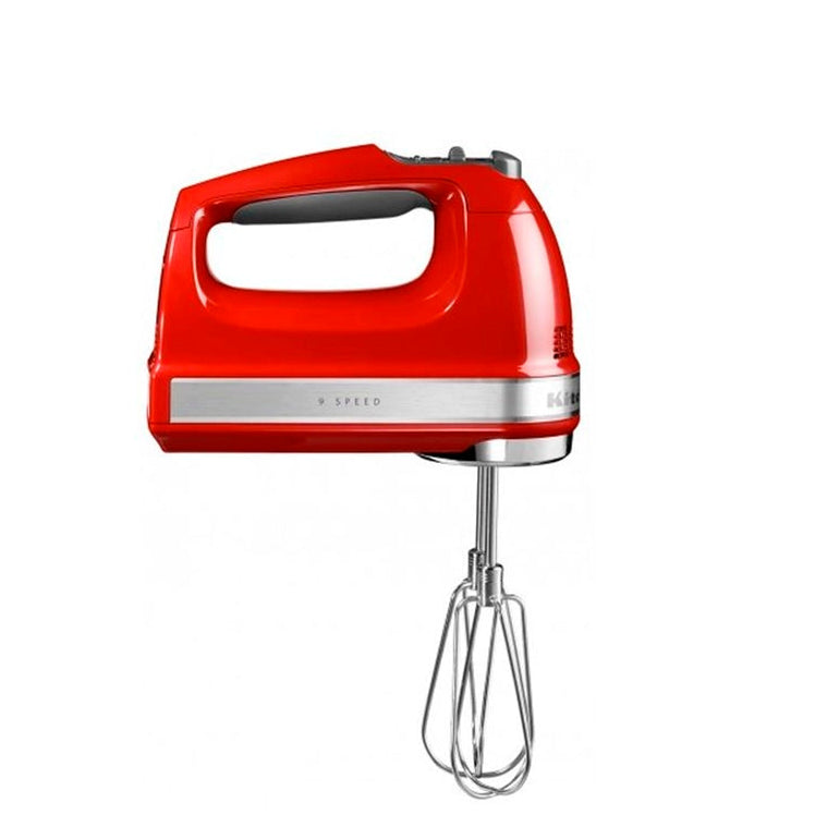 KitchenAid Red hand mixer with whisk attachment on a white background
