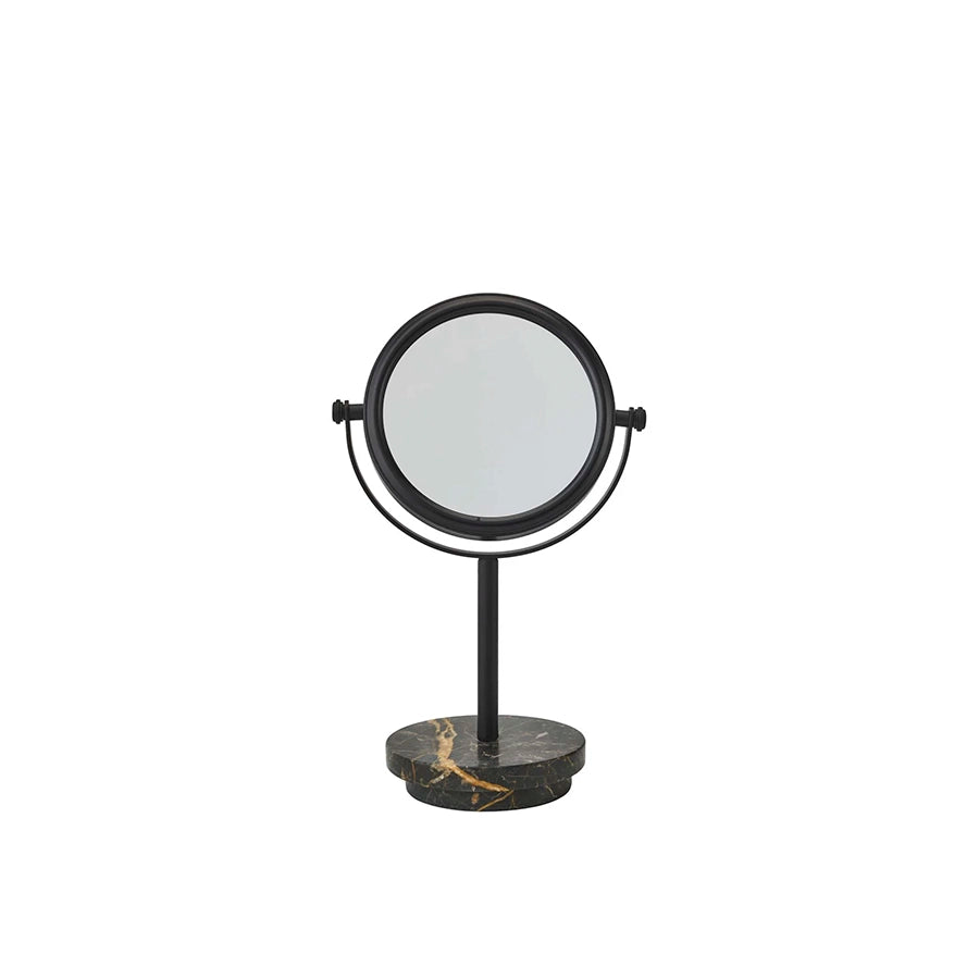 Round stand-up mirror with black frame and marble base on a white background