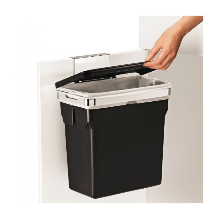 Simplehuman In-Cabinet Bin-Black wall-mounted trash bin with a hand opening the lid on a white background