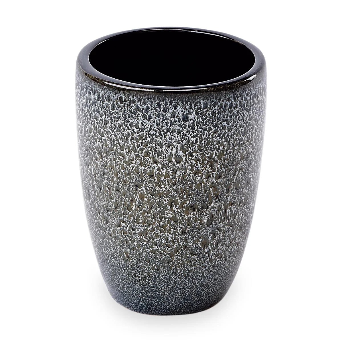 Textured ceramic cup with black interior on a white background