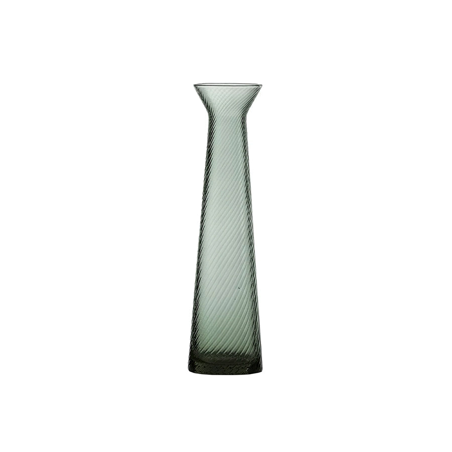 Tall, ribbed glass vase on a white background