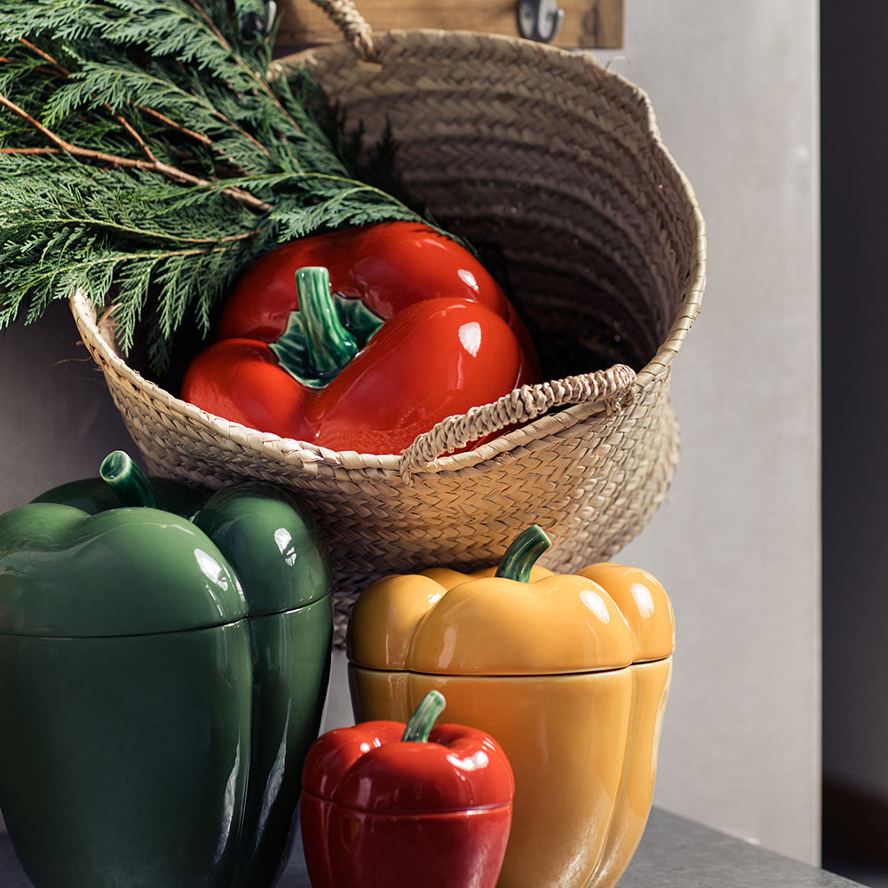 Decorative ceramic containers shaped like vegetables on a neutral background