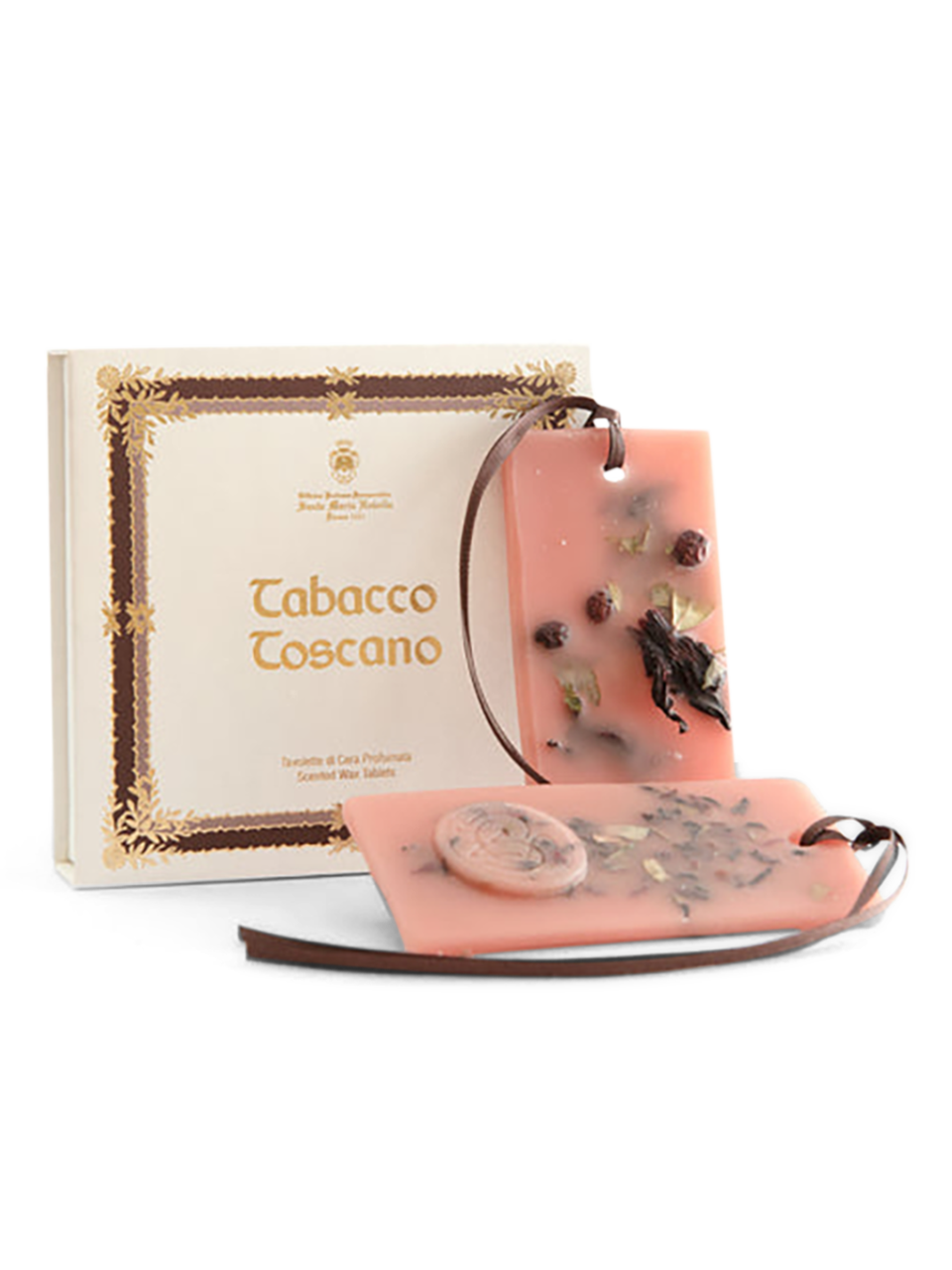 A package of Santa Maria Novella Tabacco scented wax tablets, with one pink wax tablet visible in front of the package, and a brown box with gold decorations in the background.