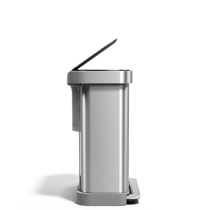 Silver trash can with a lid on a white background