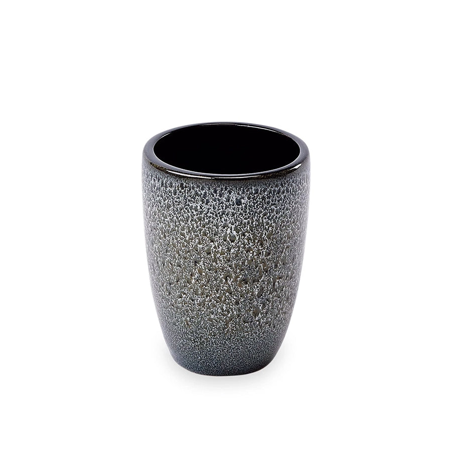 Black textured ceramic cup on a white background