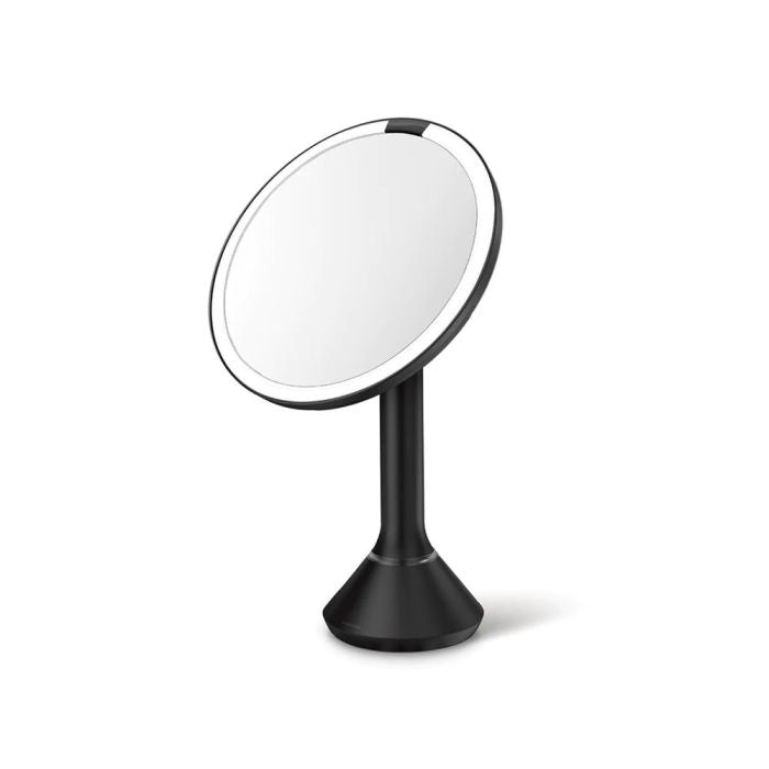simplehuman Round Sensor Mirror-Black stand-alone makeup mirror with a round, illuminated surface on a white backgrounddresser-with-mirror-uae-beauty-lounge-dressing-table-mirror-dubai-luxury-vanity-wall-mirror-for-dubai-bedrooms