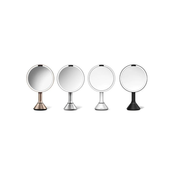 simplehuman Round Sensor Mirror Four round mirrors with metallic stands on a white backgrounddresser-with-mirror-uae-beauty-lounge-dressing-table-mirror-dubai-luxury-vanity-wall-mirror-for-dubai-bedrooms