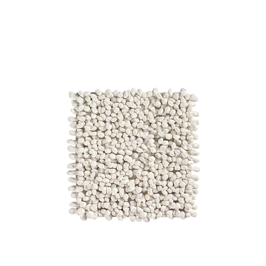 Square piece of textured white fabric on a white background