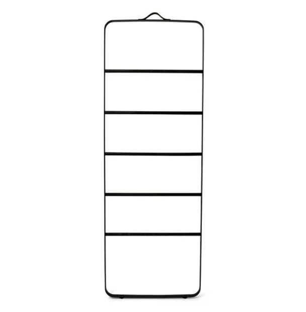 A black towel ladder with a leather strap at the top, featuring a minimalist design with several compartments.