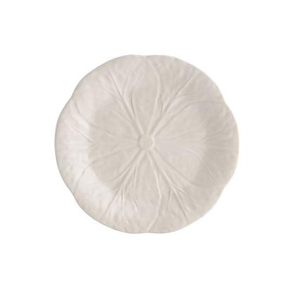 Round white pillow with pleated texture on a white background
