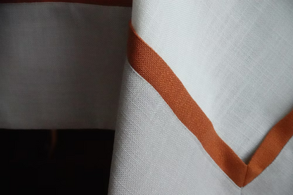22 Maggio Istanbul Calvino Designer Table Cloth-Close-up of fabric with a brown stripe on a white background