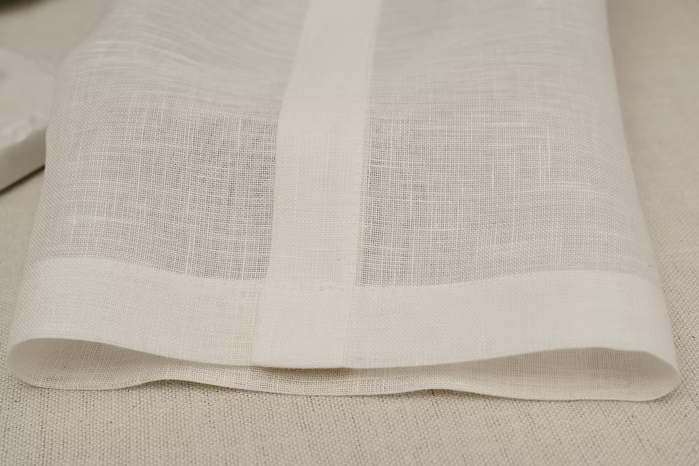22 Maggio Istanbul Sereno Linen Napkin Set of 4-Close-up of beige fabric with a subtle pattern on a matching background
