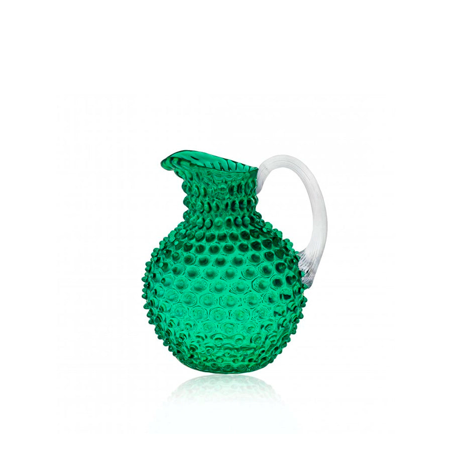 Green textured pitcher on a white background