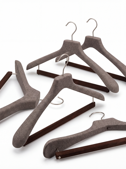 Hanger for suits with a velvet covered bar for trousers