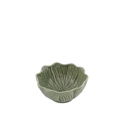 Green ceramic bowl with leaf design on a white background