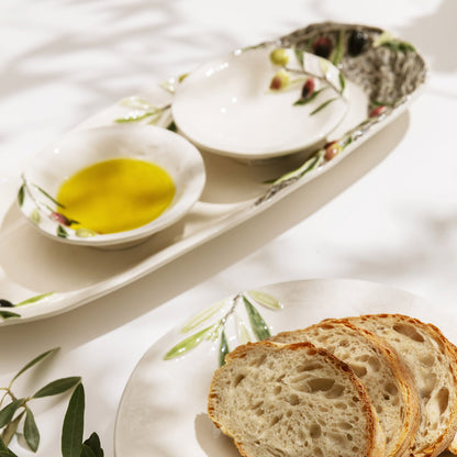 Bordallo Pinheiro Olival Small Bowl-Bread slices on a decorative plate with olive oil and olives.