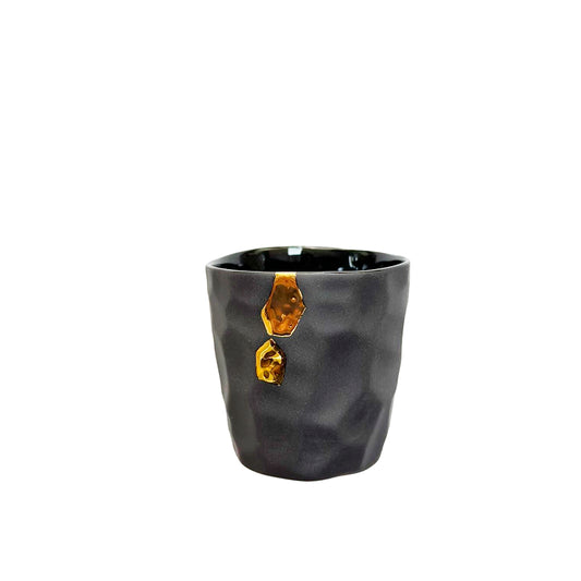 Gray ceramic Cawa Cups with gold accent on a white background