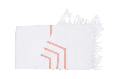 Coral Beach Towel-White pillowcase with geometric pink design on a white background