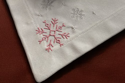 Cristallo Placemat Set of 4-Embroidered snowflake design on a fabric surface