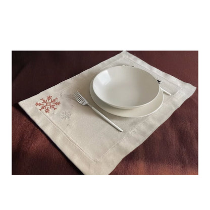 Cristallo Placemat Set of 4-White ceramic bowls on a decorative placemat with cutlery on a brown surface