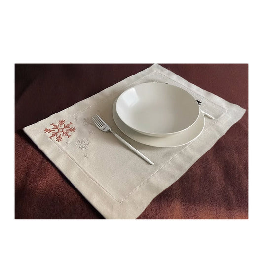 Cristallo Placemat Set of 4-White ceramic bowls on a decorative placemat with cutlery on a brown surface