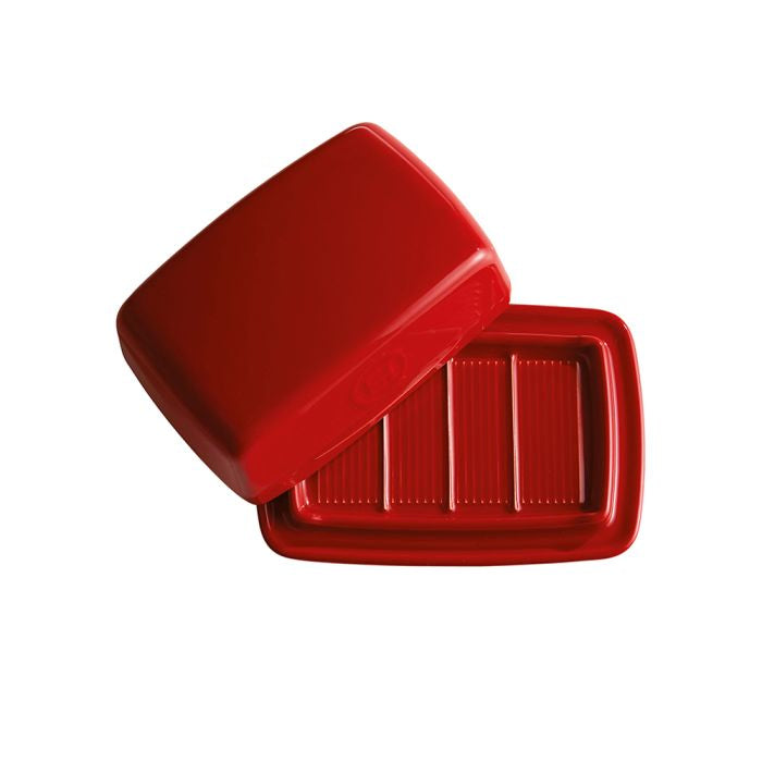 Emile Henry Butter Dish-Red plastic container with a lid on a white background