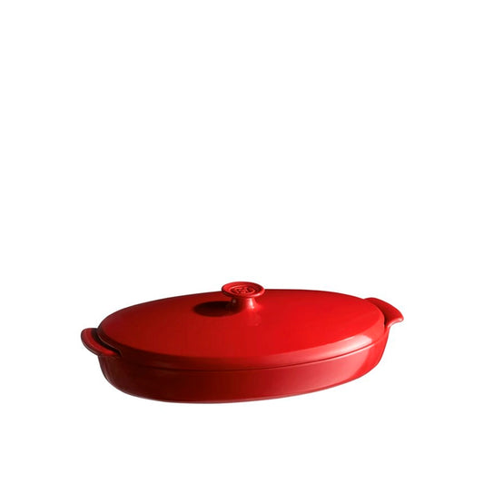 Emile Henry Covered Fish Steamer-Red oval baking dish with lid on a white background