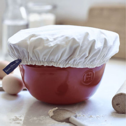 Emile Henry Reusable Organic Cotton Cover-Red mixing bowl with a white cover on a kitchen counter