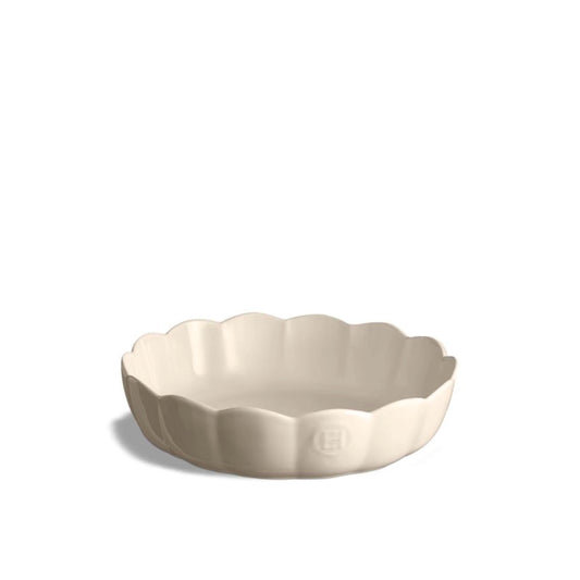 Emile Henry Round Cake Dish-Beige ceramic pie dish with scalloped edge on a white background
