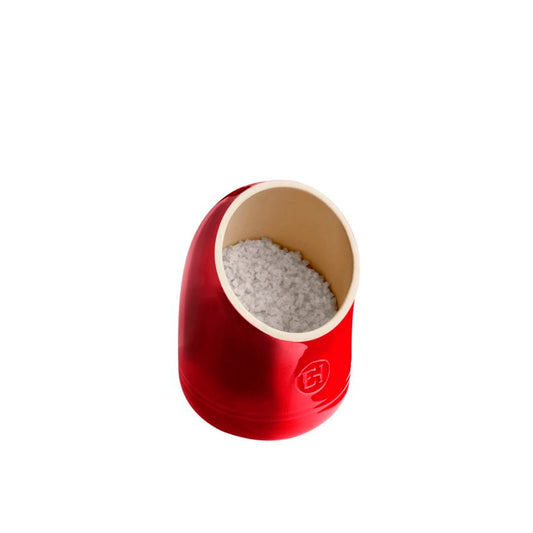 Emile Henry Salt Keeper-Red salt shaker with a white interior on a white background
