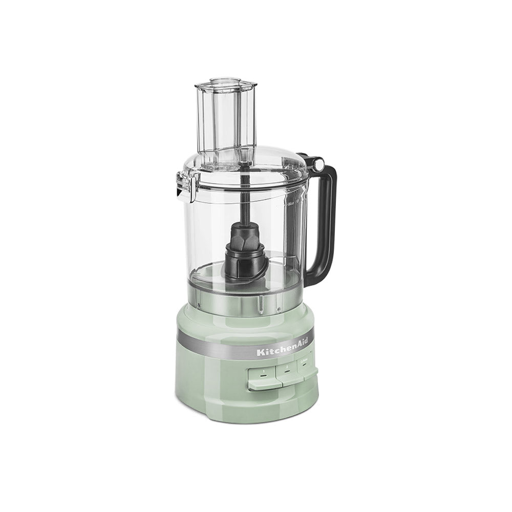 Mint green food processor with clear container on a white background