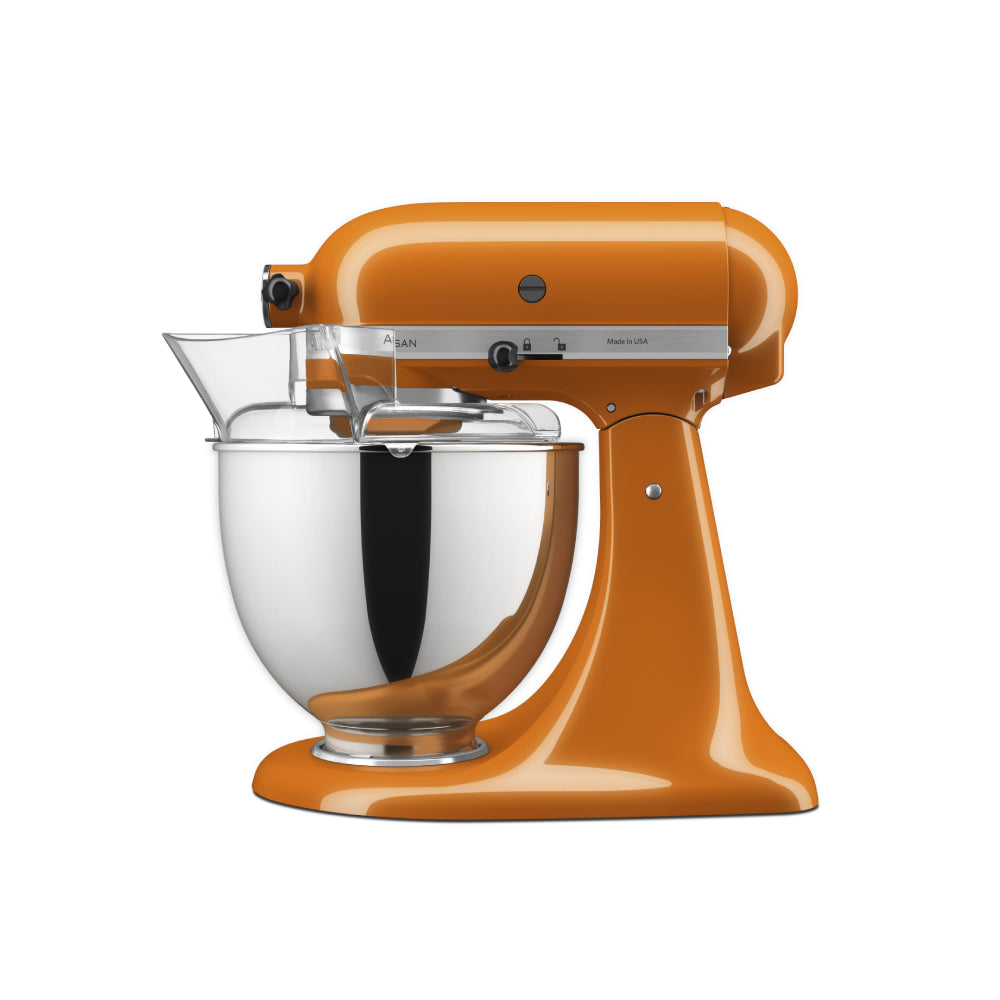 Orange stand mixer with a clear mixing bowl on a white background
