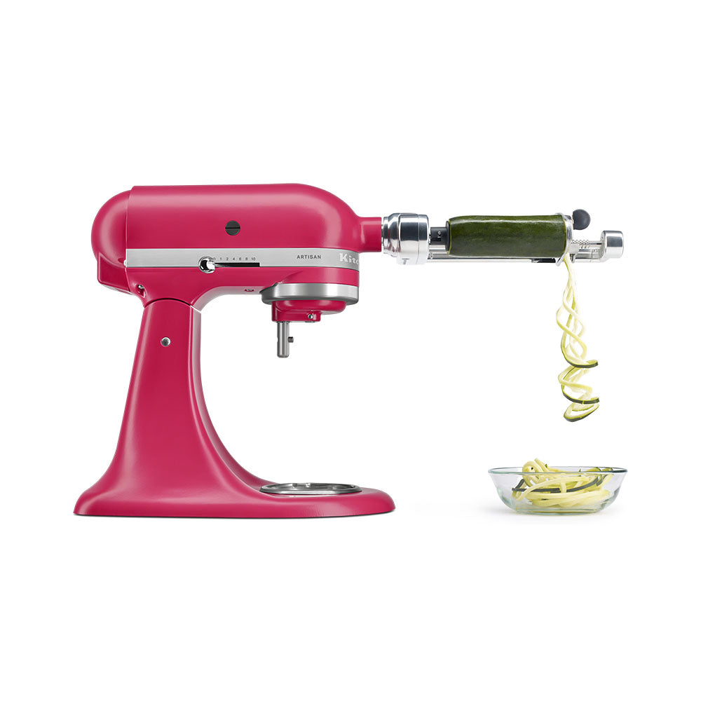 Red stand mixer with a spiralizer attachment on a white background