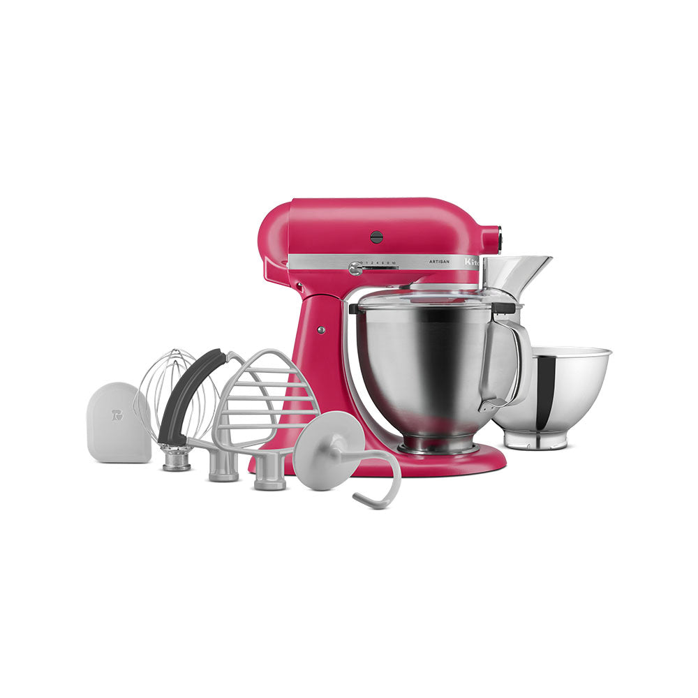 Pink stand mixer with attachments on a white background