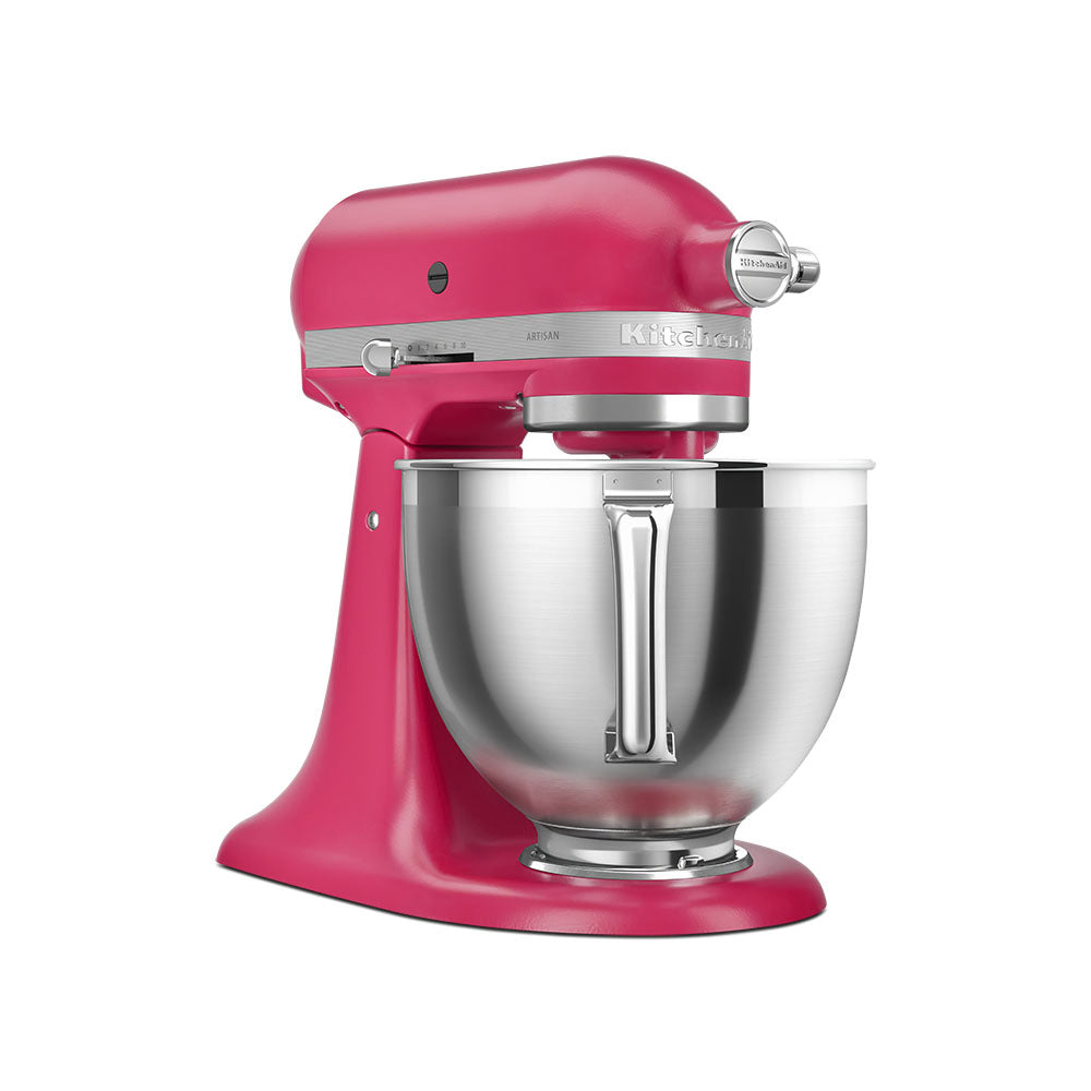 Pink KitchenAid stand mixer with a silver bowl on a white background