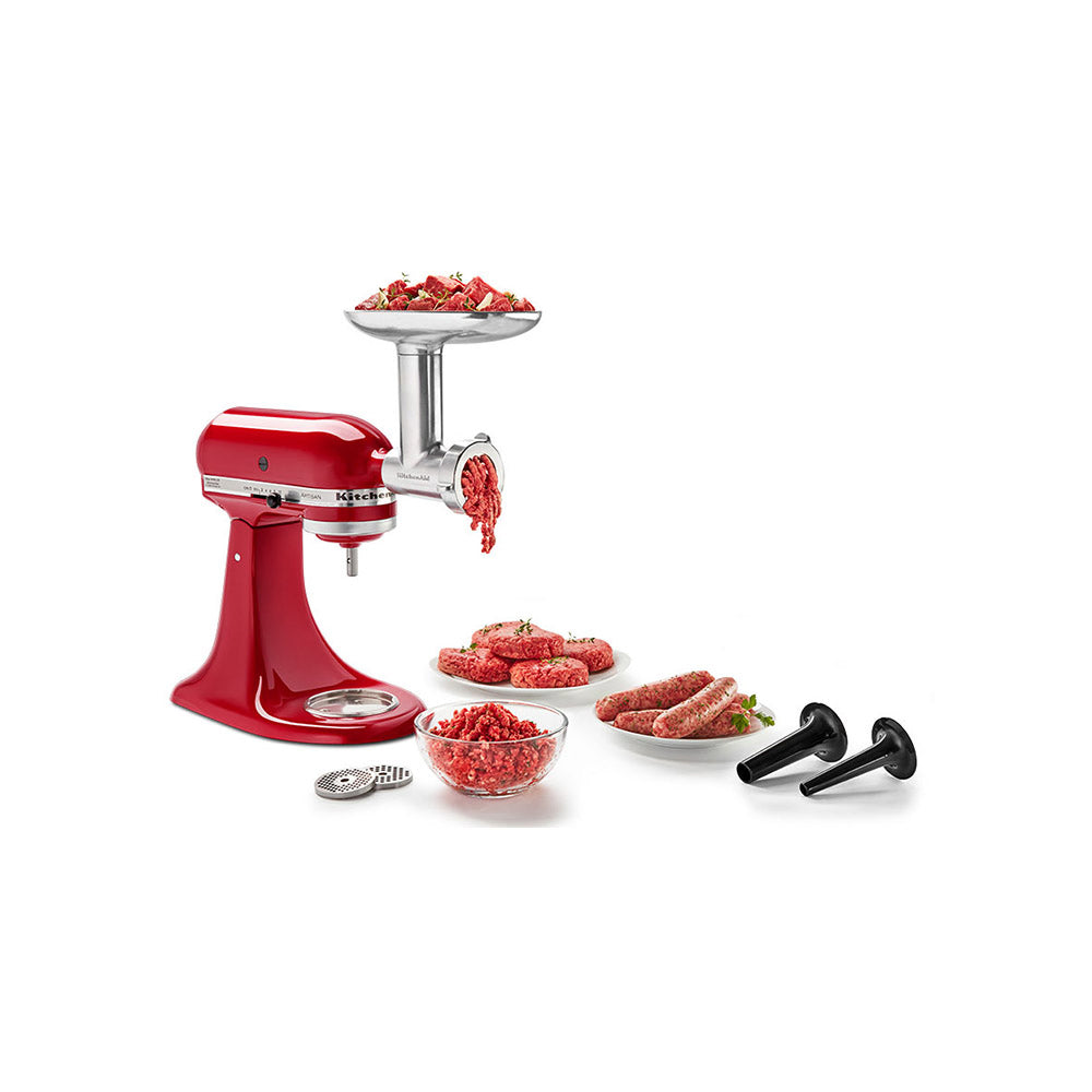 Red kitchen meat grinder with ground meat on a white background