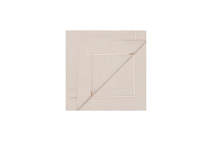 Latte Dinner Napkin Set of 4-Beige fabric swatch with a subtle pattern on a white background