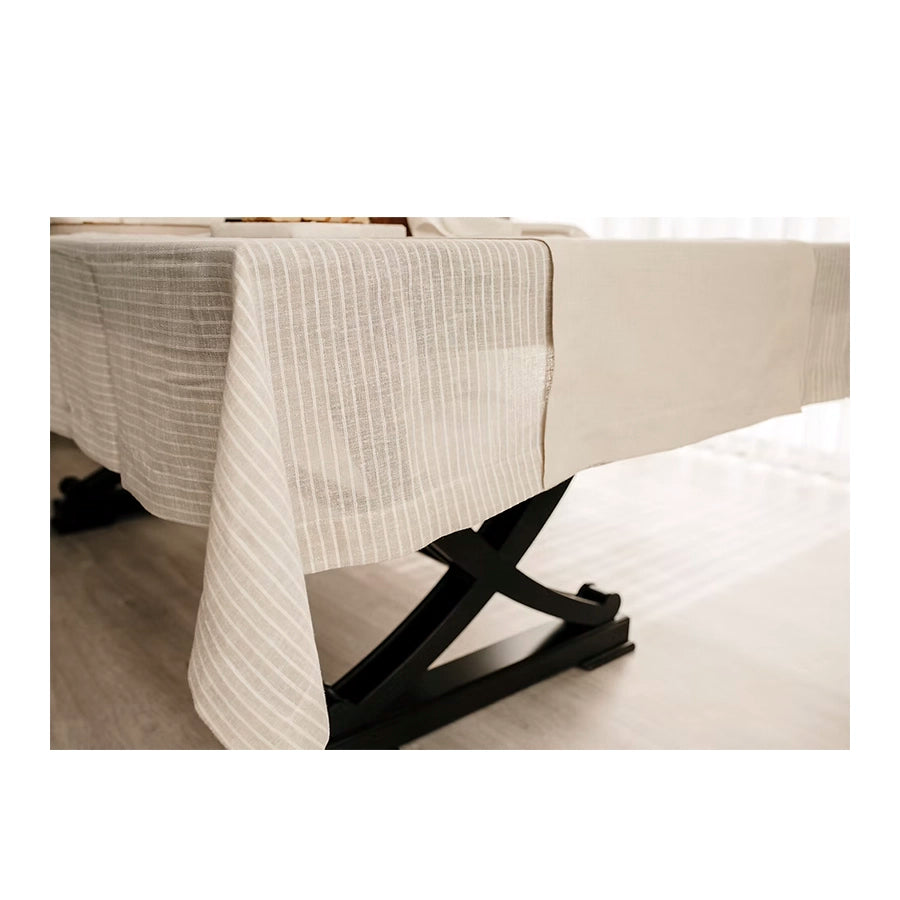 Lino Linen Table Runner-Black bed rail on a beige bed with white bedding