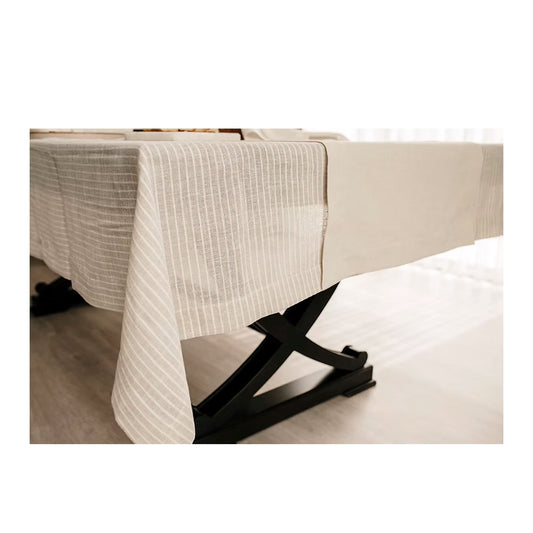 Lino Linen Table Runner-Black bed rail on a beige bed with white bedding